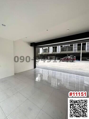 Spacious and well-lit living room with large sliding doors and a view of the neighborhood