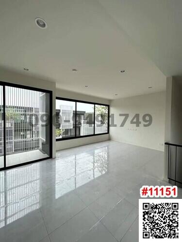 Spacious and bright empty room with large windows and glossy tiled flooring in a modern building