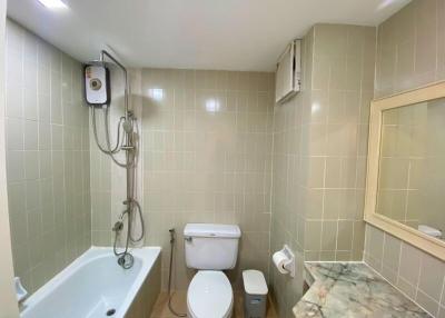 Compact bathroom with modern amenities