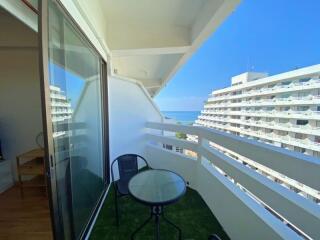 Balcony with ocean view and seating arrangement