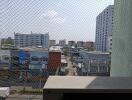 Urban view from a window with safety net