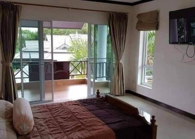Spacious bedroom with terrace access and modern amenities