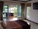 Spacious bedroom with terrace access and modern amenities