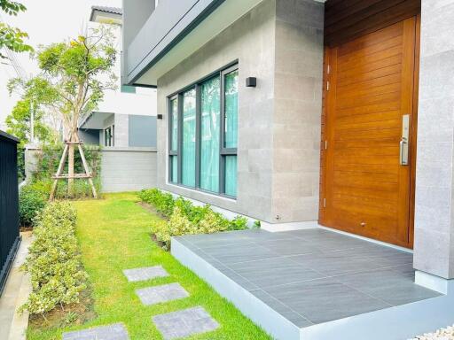 Modern home exterior with landscaped garden