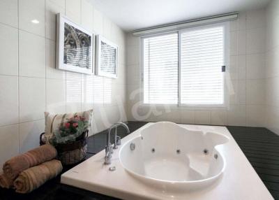 Modern bathroom with spa bathtub and elegant decor