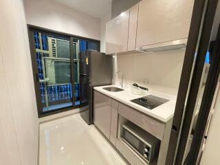 Modern compact kitchen with glossy finish