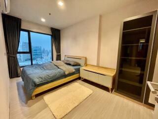 Modern bedroom with city view and en suite bathroom