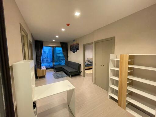 Spacious modern living room with balcony access and natural light