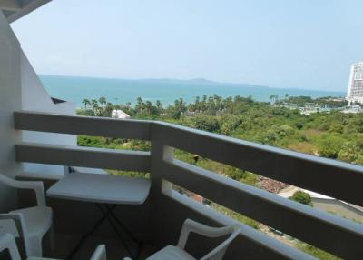 Balcony view overlooking the sea with seating arrangement