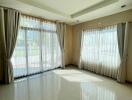 Spacious living room with large windows and natural light