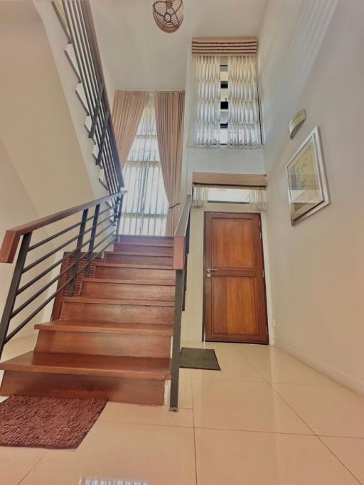 Elegant entrance hall with staircase and natural light