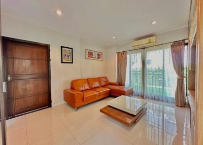 Spacious living room with modern furniture and large windows