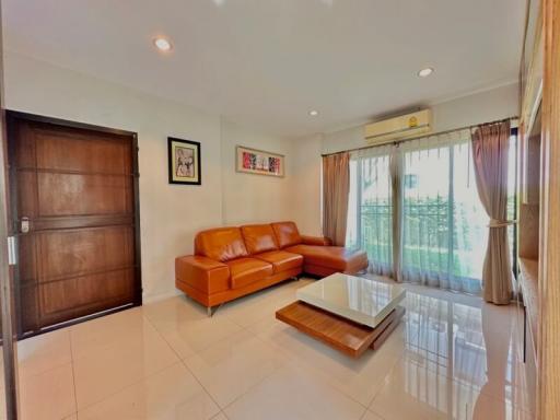 Spacious living room with modern furniture and large windows