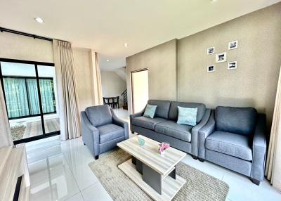 Contemporary living room with comfortable seating and natural light