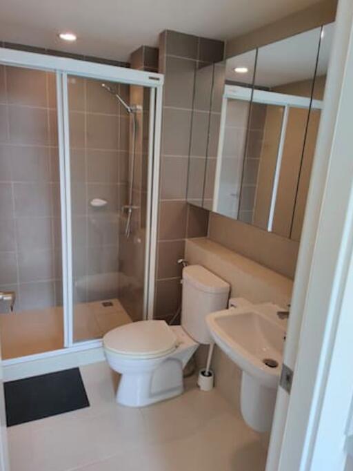 Modern bathroom interior with shower and bathtub