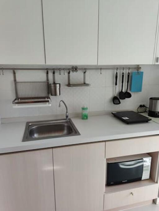 Modern kitchen with stainless steel sink and built-in appliances