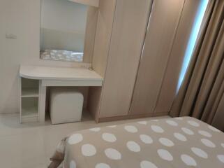 Modern bedroom interior with a comfortable bed and built-in wardrobe