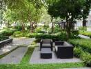 Modern outdoor seating in a lush garden common area