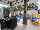 Spacious patio with outdoor furniture and pool