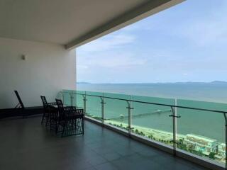 Spacious balcony with a sea view and outdoor sitting area