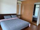 Spacious bedroom with large bed and built-in wardrobe