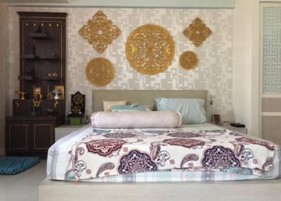 Elegantly decorated bedroom with traditional accents and wall decorations