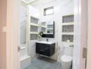 Modern bathroom interior with glass shower area, vanity, and tiled flooring