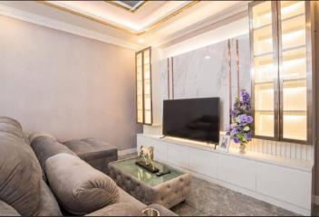 Elegantly designed living room with modern furniture and decorative lighting
