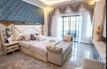 Luxurious bedroom with a large bed and elegant decor