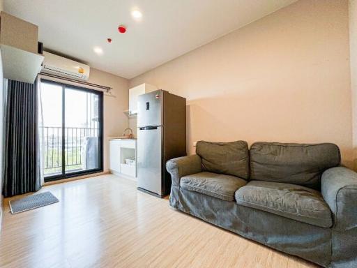 Cozy living room with sofa and modern appliances