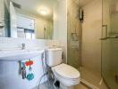 Modern bathroom interior with white ceramic fixtures