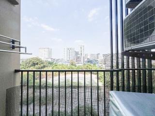 View from a high-rise apartment balcony overlooking a cityscape