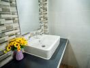 Modern bathroom sink with decorative flowers