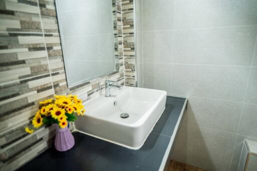 Modern bathroom sink with decorative flowers