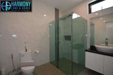 Modern bathroom with a glass shower enclosure and vanity sink