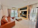 Spacious living room with modern furniture and natural light