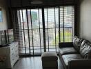 Modern living room with large windows and city view