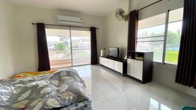 Bright and airy bedroom with large windows and modern amenities