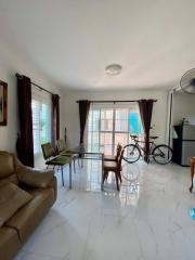 Bright and spacious living room with polished tile flooring