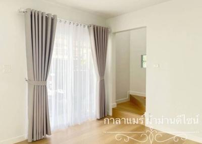 Bright and airy unfurnished bedroom with large windows and hardwood floors