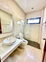 Modern bathroom with neutral colors, natural light, and clean lines