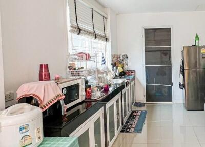 Well-equipped kitchen with modern appliances and ample countertop