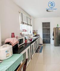 Well-equipped kitchen with modern appliances and ample countertop