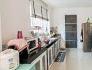 Well-equipped kitchen with modern appliances and ample countertop