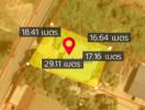 Aerial view of a land plot with measurements