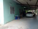 Front view of a house with carport and parked car