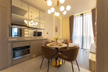Modern kitchen with dining area, featuring brown tones and contemporary lighting