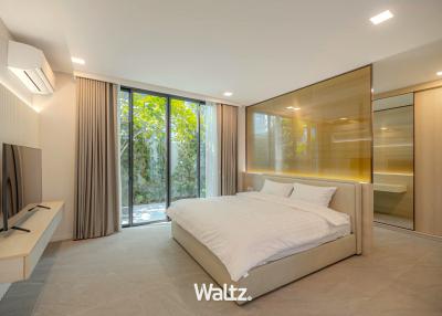 Modern bedroom with large window and sleek design