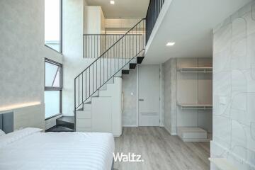 Modern bedroom interior with mezzanine and minimalist decor