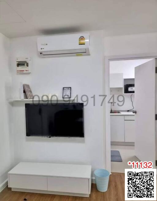 Modern living room interior with air conditioning and flat-screen TV